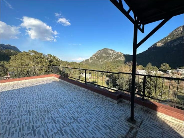 Rooftop terrace of Gedeller Villa overlooking the pine-covered peaks of the Taurus mountains